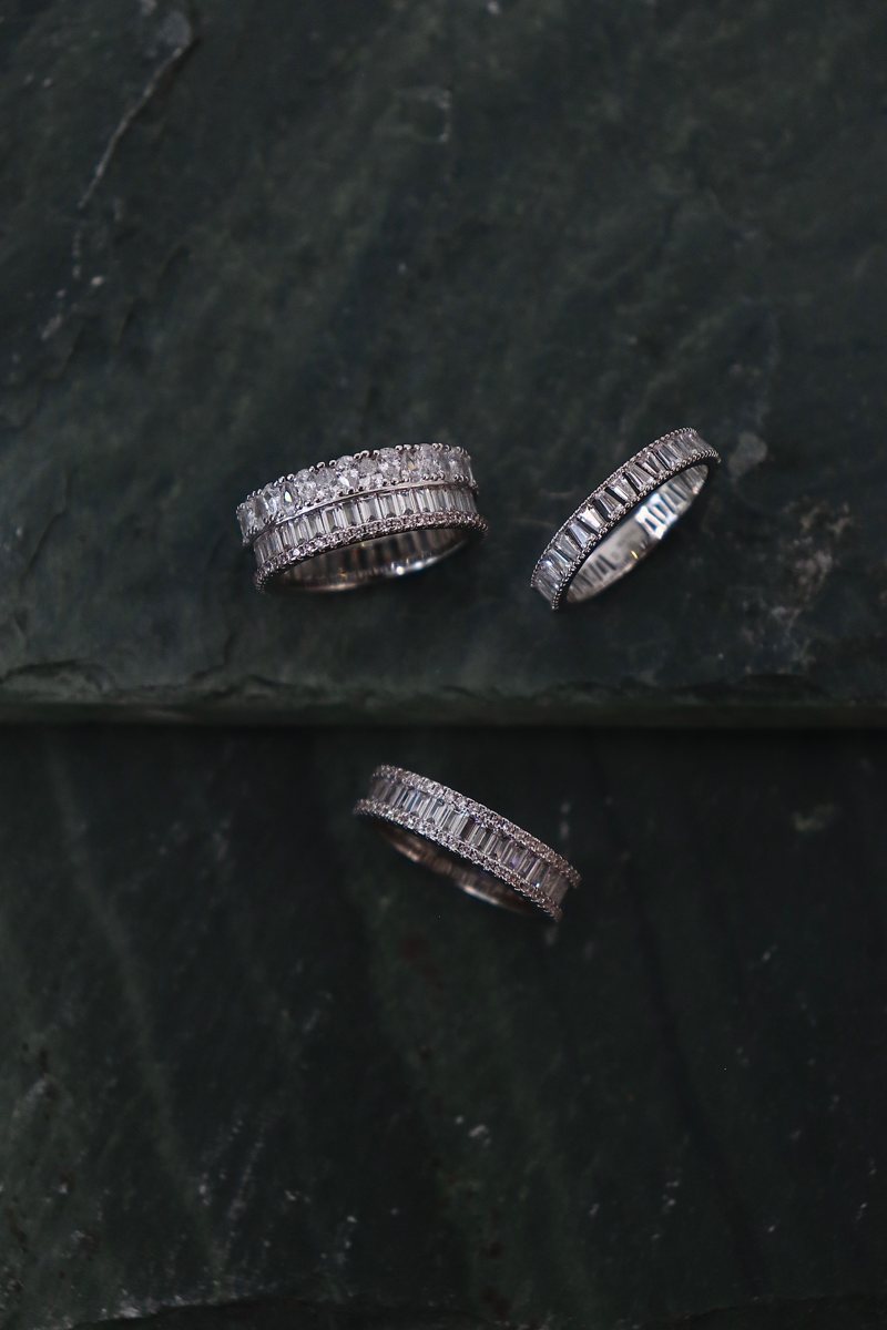 Three diamond eternity bands on green slate