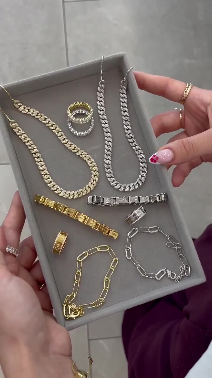 Reel: velvet tray of gold and silver chains and rings